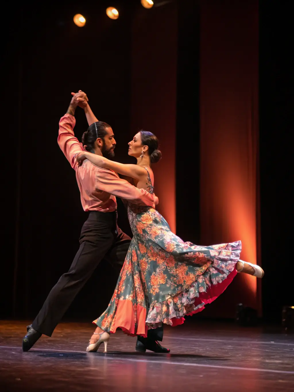 A couple gracefully performing a tango, highlighting the elegance and connection of partner dancing.